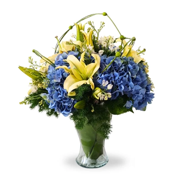 Blue Serenity hydrangea and white lily vase arrangement with fresh flowers in glass vase Malaysia