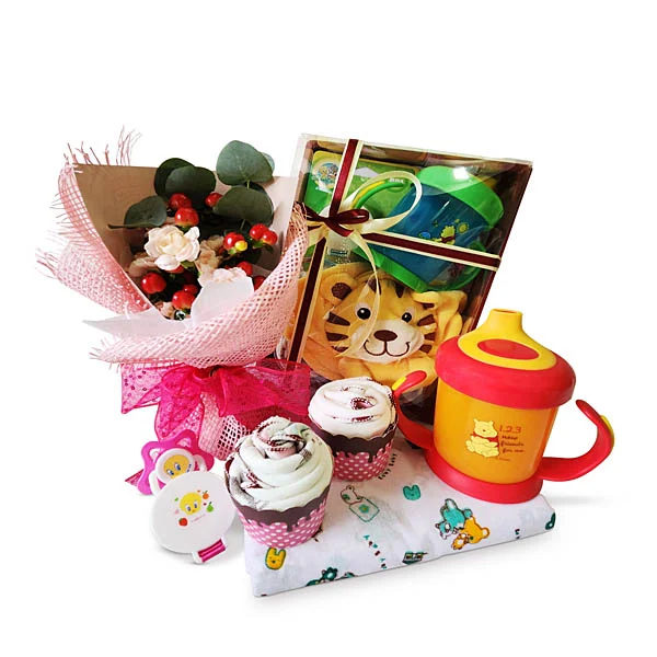 Disney Bébé newborn baby essentials gift hamper with Disney training cup, baby cap, diaper, cupcake towels and flowers.