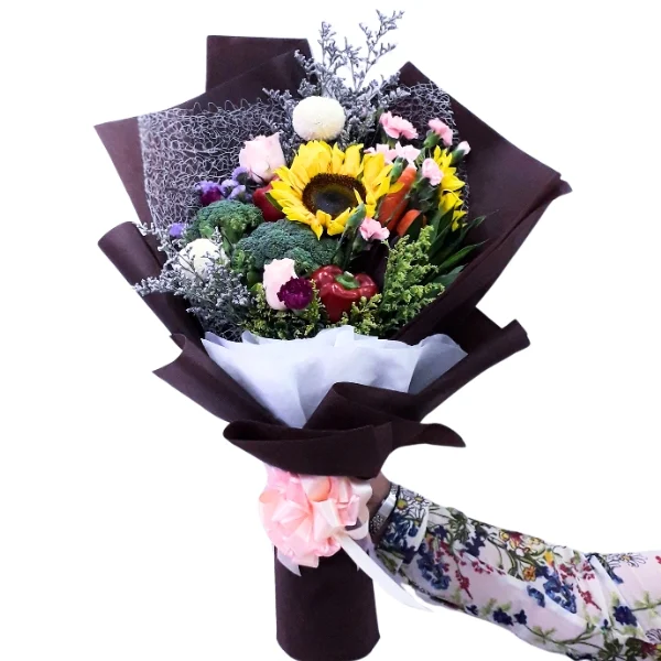 Vegetable and sunflower bouquet with fresh vegetables and chrysanthemums