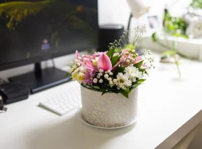 colorful-flower-arrangement-on-a-desk-next-to-comp-2026-03-05-11-57-26-utc