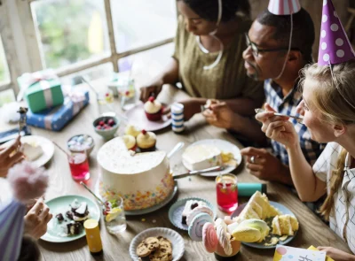 friends-celebrate-birthday-party-with-cake-and-gif-2026-01-07-23-21-39-utc