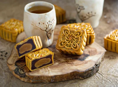 mooncakes-and-tea-served-on-a-wood-board-2026-03-24-04-48-18-utc