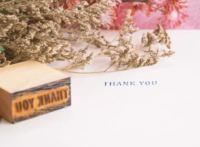 thank-you-message-with-flowers-and-wooden-stamp-2026-03-17-21-29-17-utc
